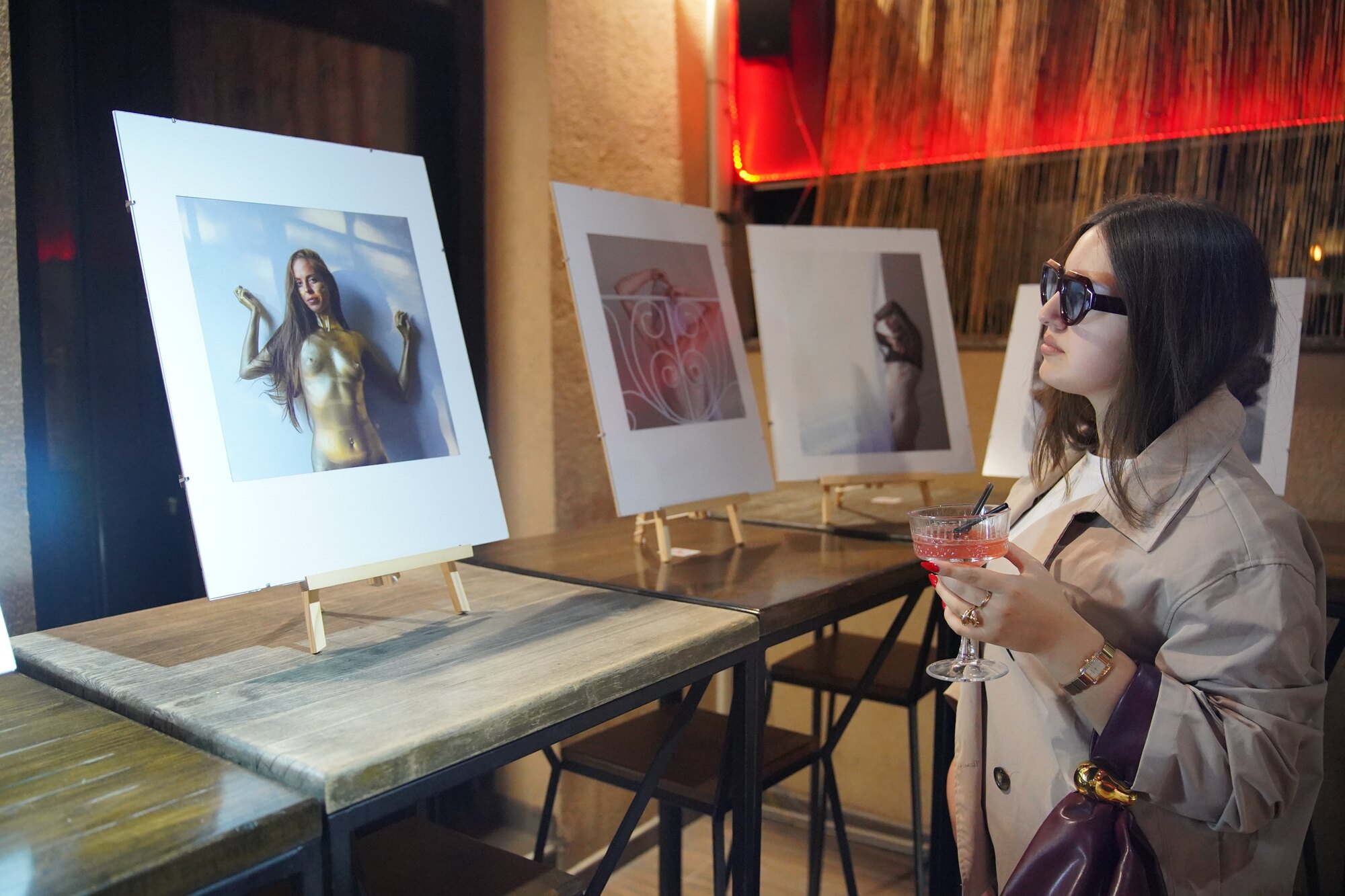 A visitor viewing a photograph at the exhibition