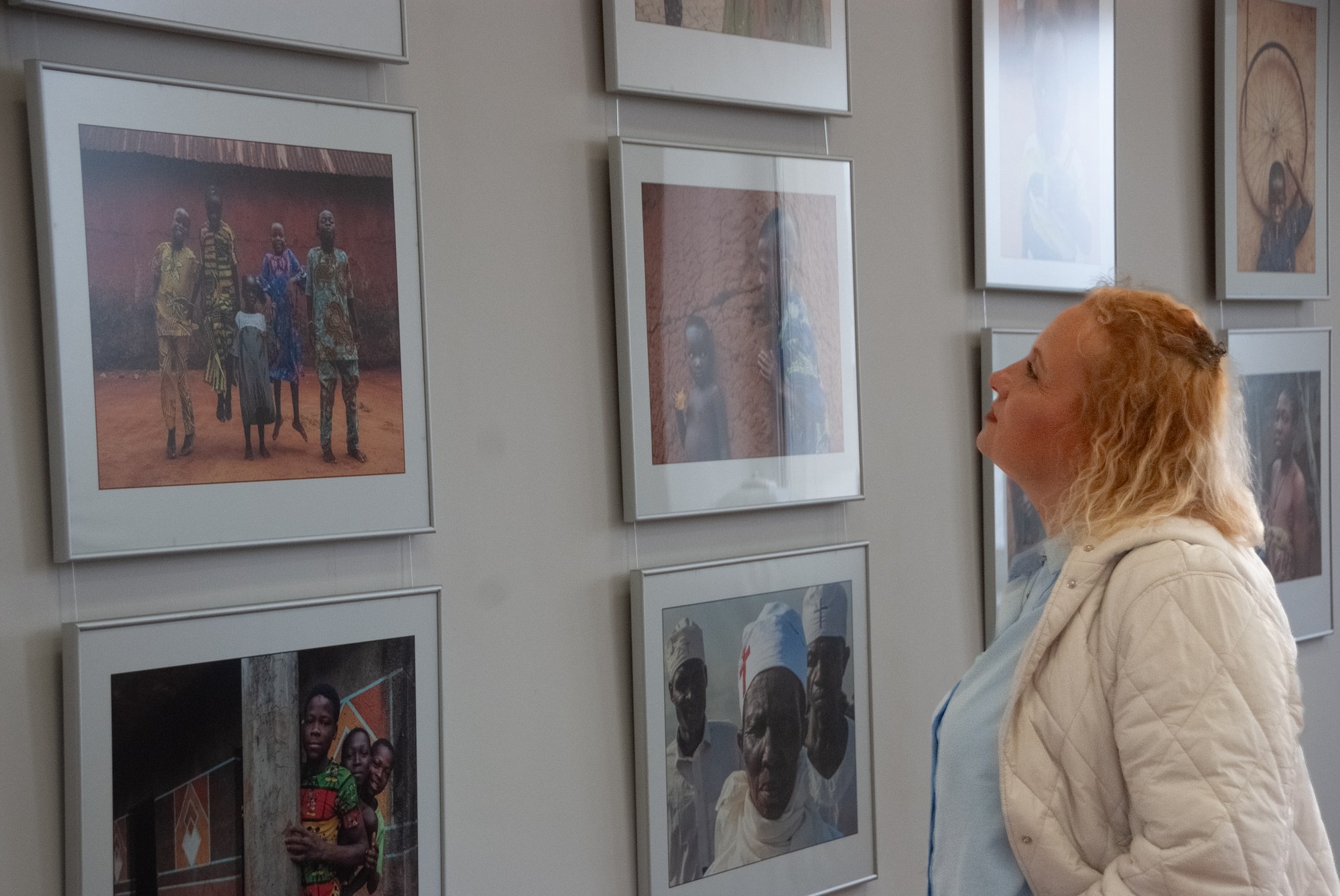 A visitor viewing the exhibited photographs
